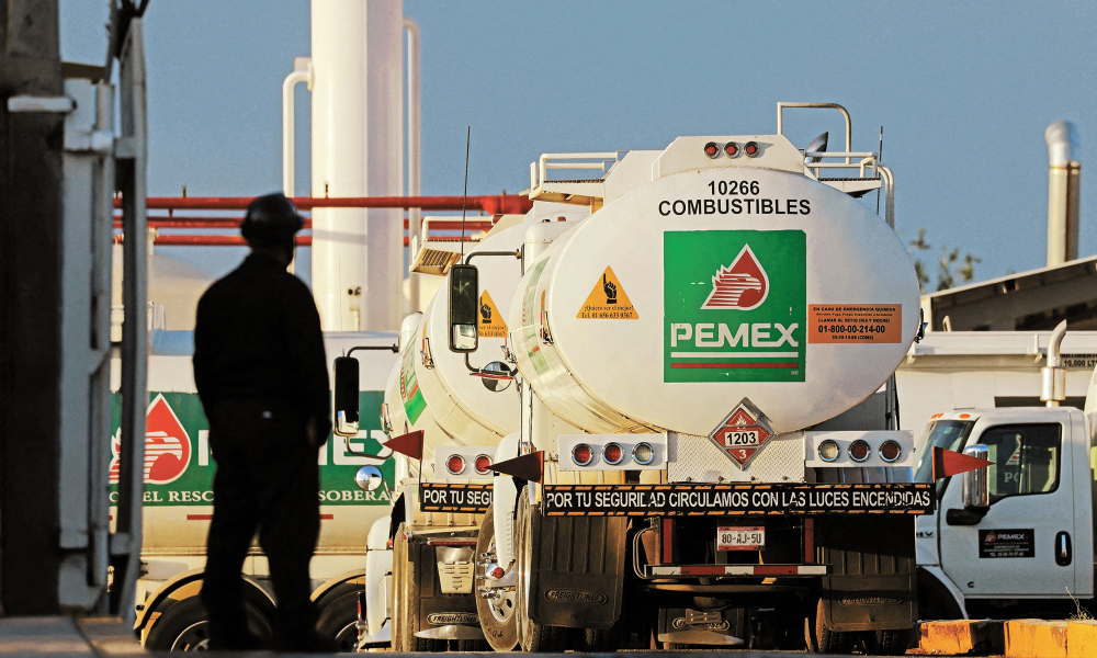 Worker stands near tanker truck at Petroleos Mexicanos (PEMEX) fuel storage and distribution center in Ciudad Juarez