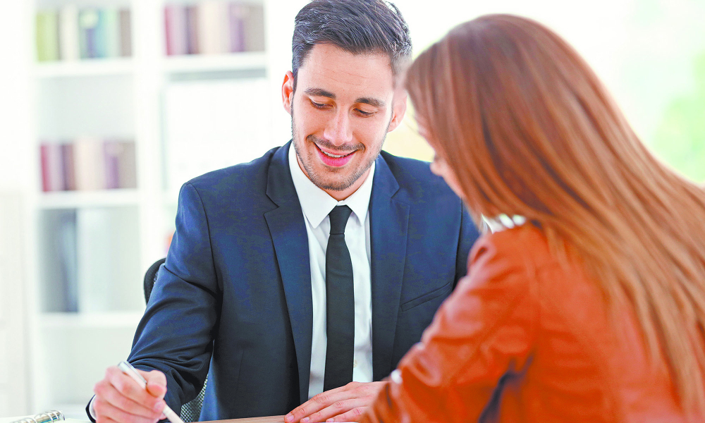 Woman,Meeting,Financial,Adviser,In,Office