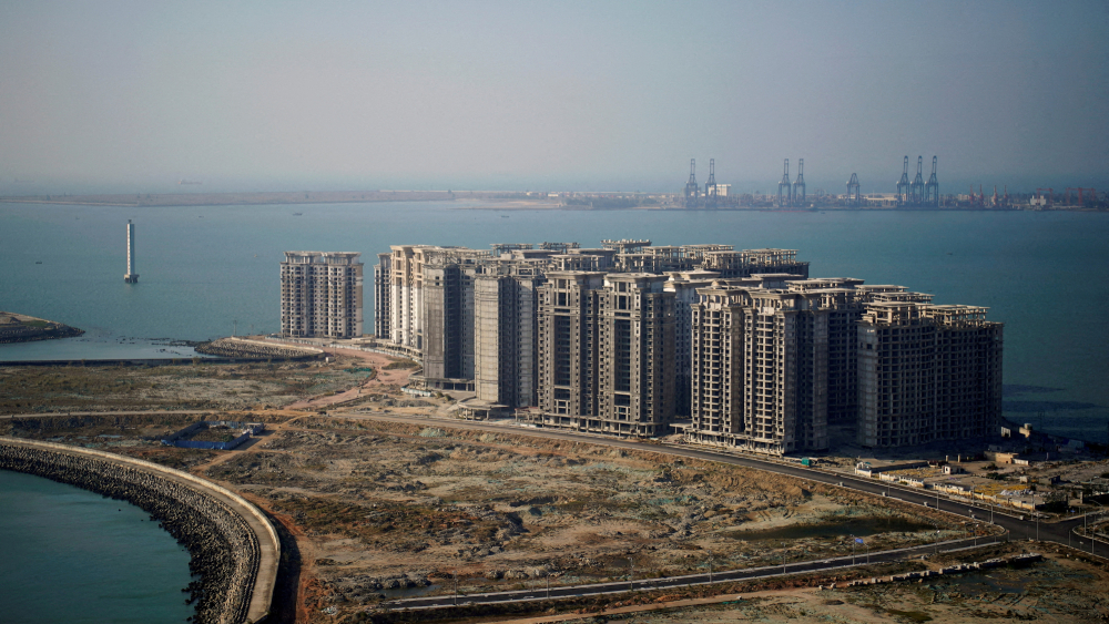 FILE PHOTO: An aerial view shows the 39 buildings developed by China Evergrande Group that authorities have issued demolition order, on the man-made Ocean Flower Island in Danzhou, Hainan province, China January 6, 2022. REUTERS/Aly Song/File Photo-NARCH/NARCH30 NARCH/NARCH30 NARCH/NARCH30