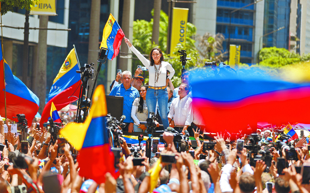 La líder opositora María Corina Machado encabezó ayer en Caracas, nueva protesta. Foto: AFP