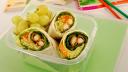 School lunch of fried chicken & avocado wrap sandwich