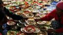 A volunteer prepares breakfast for villagers at a camp in the district of Tanah Karo