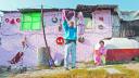A man hangs up clothes to dry in a low-income neighborhood in Mexico City