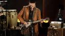 FILE PHOTO: Singer/songwriter Neil Young performs during a concert honoring singer/songwriter Willie Nelson, recipient of the Library of Congress