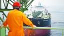 An employee looks at the offloading (FPSO) vessel, a 360,000 ton ship, while standing on Mexico