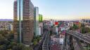 Mexico City - october 23, 2018: Panoramic aerial view of busy avenues full of cars and surrounded by buildings near the Lomas de Chapultepec neighborhood