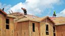 FILE PHOTO: Carpenters work on building new townhomes in Tampa, Florida