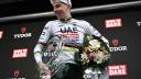 UAE Team Emirates team's Slovenian rider Tadej Pogacar celebrates his victory with the trophy on the podium after winning the 118th edition of the Giro di Lombardia (Tour of Lombardy), a 252km cycling race from Bergamo to Como on October 12, 2024. (Photo by Marco BERTORELLO / AFP)