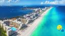 Cancun beach with para sailing over water