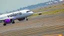 A Volaris airplane is pictured on the airstrip at Benito Juarez international airport in Mexico City, Mexico, May 9, 2022. REUTERS/Edgard Garrido