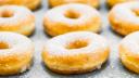 Sweet dessert with many donut on top with sugar icing - Unhealthy food style