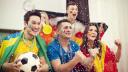 Multinational football supporters celebrating goal