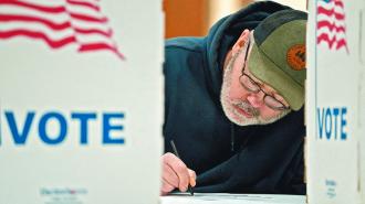 FILE PHOTO: Wisconsin resident Cary Pallas prepares to vote in the presidential primary election at the Central Assembly of God church polling place in Douglas County in Superior, Wisconsin, U.S. April 2, 2024. REUTERS/Erica Dischino/File Photo