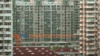 A general view shows buildings in a residential area in the Jing'an district in Shanghai on September 28, 2024. (Photo by Hector RETAMAL / AFP)