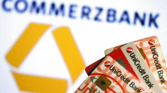 FILE PHOTO: UniCredit credit cards are seen in front of a displayed Commerzbank logo in this illustration taken September 20, 2017. REUTERS/Dado Ruvic/Illustration/File Photo