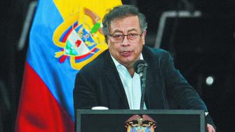 Colombia's President Gustavo Petro speaks during the eighth commemoration of the signing of the peace agreement between the Colombian government and the FARC guerrillas at Bolivar Square in Bogota on November 21, 2024. (Photo by Andrea ARIZA / AFP)