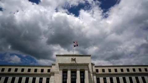 FILE PHOTO: Clouds over the Federal Reserve in Washington - FILE PHOTO: Flags fly over the Federal Reserve Headquarters on a windy day in Washington, U.S., May 26, 2017. REUTERS/Kevin Lamarque/File Photo                    GLOBAL BUSINESS WEEK AHEAD   SEARCH GLOBAL BUSINESS 18 SEP FOR ALL IMAGES - NARCH/NARCH30