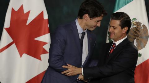 Canadian Prime Minister Justin Trudeau, left, shakes hands with Mexican President Enrique Pena Nieto after a news conference at the National Palace in Mexico City, Thursday, Oct. 12, 2017. Trudeau is in Mexico for a two-day official visit. (AP Photo/Rebecca Blackwell)