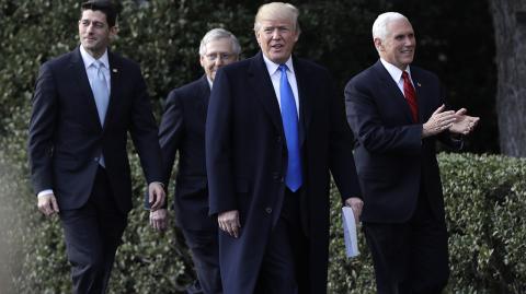 President Donald Trump walks with Vice President Mike Pence, House Speaker Paul Ryan, R-Wis., and Senate Majority Leader Mitch McConnell, R-Ky. during a bill passage event on the South Lawn of the White House in Washington, Wednesday, Dec. 20, 2017, to acknowledge the final passage of tax overhaul legislation by Congress. (AP Photo/Evan Vucci)