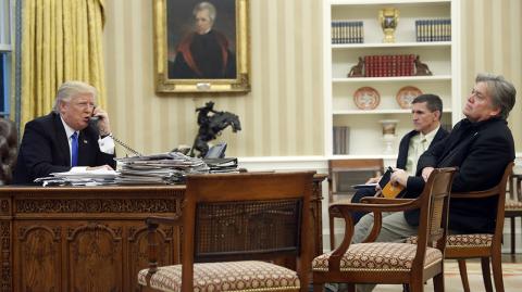 Donald Trump,Michael Flynn,Steve Bannon - FILE - In this Jan. 28, 2017, file photo, President Donald Trump speaks on the phone with Prime Minister of Australia Malcolm Turnbull, with then-National Security Adviser Michael Flynn, center, and then- chief strategist Steve Bannon, right, in the Oval Office of the White House in Washington. Trump responded to criticism leveled at him in a new book that says he never expected — or wanted — to win the White House, his victory left his wife in tears and a senior adviser thought his son