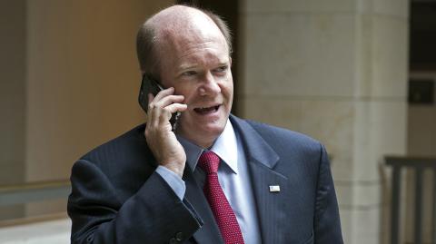 Chris Coons - Senate Foreign Relations Committee member Chris Coons, D-Del., talks on a phone as he leaves briefing on the Administration’s response to the Syrian conflict, in a closed session in Washington, Tuesday, Oct. 27, 2015. (AP Photo/Cliff Owen)