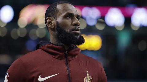 Brad Stevens, LeBron James - Cleveland Cavaliers forward LeBron James warms up before Game 2 of the team