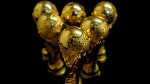 FILE PHOTO: FILE PHOTO: Scaled-down replicas of 2018 FIFA World Cup trophy are displayed at a factory in Dongguan - FILE PHOTO: FILE PHOTO: Scaled-down replicas of 2018 FIFA World Cup trophy are displayed at the showroom of a factory which manufactures official licensed products in Dongguan, China May 8, 2018. Picture taken May 8, 2018.   REUTERS/Bobby Yip/File Photo/File Photo - NARCH/NARCH30