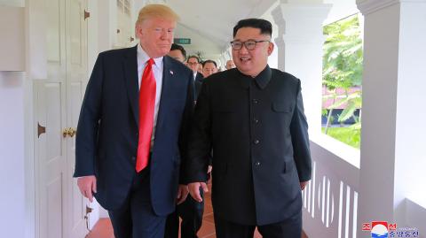 U.S. President Donald Trump walks with North Korean leader Kim Jong Un at the Capella Hotel on Sentosa island in Singapore - U.S. President Donald Trump walks with North Korean leader Kim Jong Un at the Capella Hotel on Sentosa island in Singapore in this picture released on June 12, 2018 by North Korea