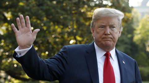 RUSSIA-TRUMP - President Donald Trump waves after speaking to members of the media at the White House before boarding Marine One to travel to Europe on July 9. Trump said he thought meeting Russian President Vladimir Putin would be the easiest part of his trip. MUST CREDIT: Yuri Gripas, Bloomberg