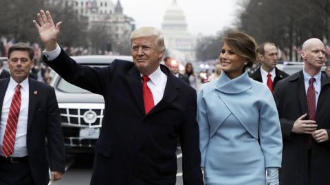 Donald Trump waves as he walks with first lady Melania Trump and his son Barron during the inauguration parade in Washington - President Donald Trump waves as he walks with first lady Melania Trump and son Barron during the inauguration parade on Pennsylvania Avenue in Washington, January 20, 2017. REUTERS/Evan Vucci/Pool