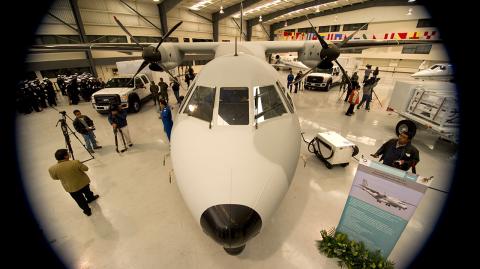 View of a Persuader CN-235 maritime surveillance aircraft and two Z Backscatter mobile screening vehicles delivered by the United States to Mexico under the Merida Initiative, in Mexico City on December 1, 2011. AFP PHOTO/Alfredo Estrella