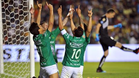 Players of Leon celebrate after scoring against America during the Mexican Clausura 2019 tournament first leg semifinal football match at La Corregidora stadium in Queretaro, Queretaro state, Mexico on May 16, 2019. (Photo by ROCIO VAZQUEZ / AFP)