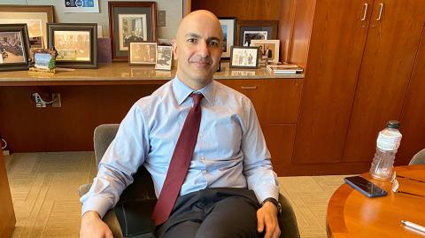 Minneapolis Federal Reserve Bank President Neel Kashkari poses during an interview with Reuters in his office at the bank