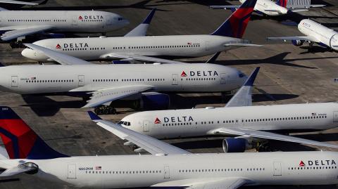 FILE PHOTO: Delta Air Lines passenger planes are seen parked due to flight reductions made to slow the spread of coronavirus disease (COVID-19), at Birmingham-Shuttlesworth International Airport in Birmingham, Alabama, U.S. March 25, 2020.  REUTERS/Elijah Nouvelage/File Photo-NARCH/NARCH30