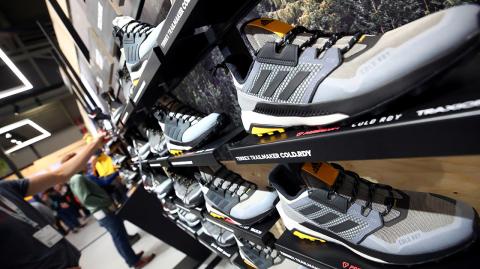 FILE PHOTO: Trail running shoes are seen at the booth of Adidas during the ISPO trade fair for sports equipment and fashion in Munich