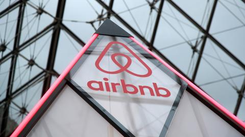 FILE PHOTO: The Airbnb logo is seen on a little mini pyramid under the glass Pyramid of the Louvre museum in Paris, France, March 12, 2019. REUTERS/Charles Platiau/File Photo-NARCH/NARCH30