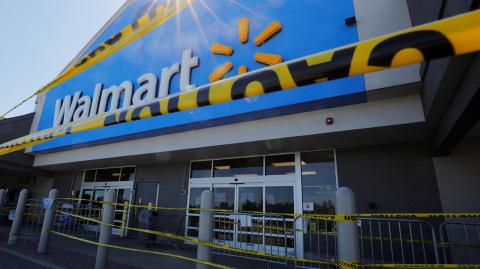 Caution tape hangs at the entrance of a temporarily closed Walmart store, where a number of employees tested positive for the coronavirus disease (COVID-19) and one employee died, in Quincy, Massachusetts, U.S., May 5, 2020.   REUTERS/Brian Snyder