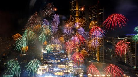 Fireworks explode over Chao Phraya River during the New Year celebrations amid the spread of the coronavirus disease (COVID-19) in Bangkok