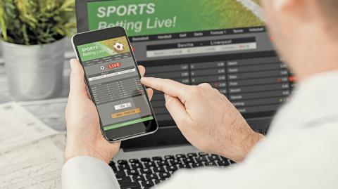 Betting,Bet,Sport,Phone,Gamble,Laptop,Over,Shoulder,Soccer,Live