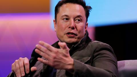 SpaceX owner and Tesla CEO Elon Musk gestures during a conversation with legendary game designer Todd Howard at the E3 gaming convention in Los Angeles