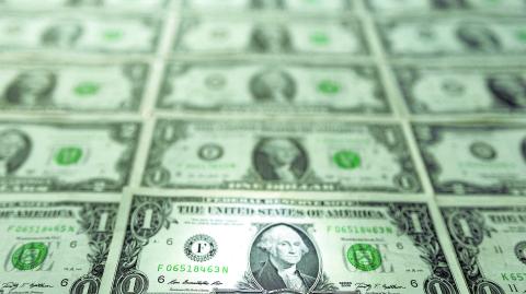 FILE PHOTO: Illustration shows U.S. dollar banknotes