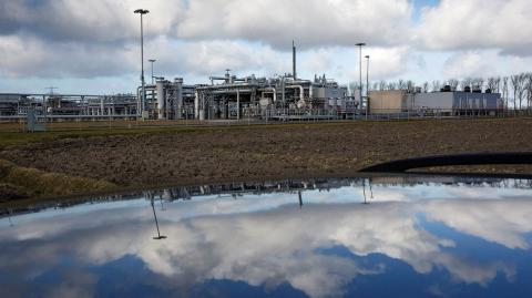 FILE PHOTO: A view of a gas production plant is reflected in the roof of a car in 