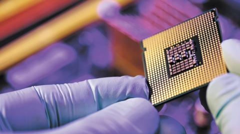 Computer support engineer installing processor. Microprocessor with clearly visible silicon core and cache chip. Installation of computer processor in the socket.