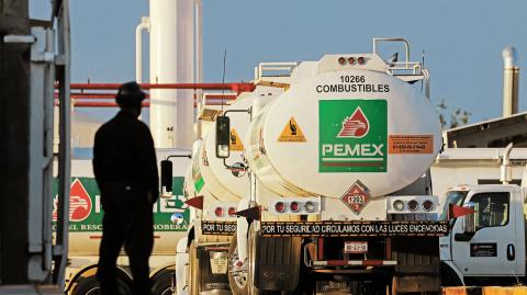 Worker stands near tanker truck at Petroleos Mexicanos (PEMEX) fuel storage and distribution center in Ciudad Juarez