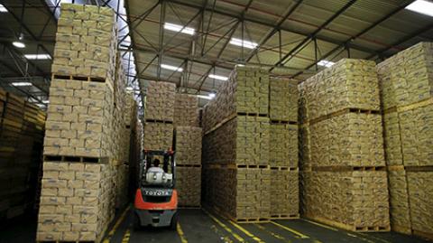 A worker uses a forklift to stack packages of PAN corn flour at an industrial complex of the food company Empresas Polar in Turmero in the state of Aragua, Venezuela October 23, 2015. Socialist Party legislators on Wednesday asked state prosecutors to investigate Venezuela's billionaire businessman Lorenzo Mendoza and Harvard economist Ricardo Hausmann for alleged crimes including