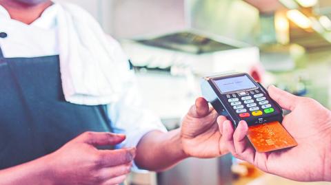 Hands,Of,Customer,Paying,Restaurant,Bill,Using,Credit,Card.,Customer