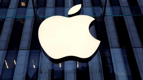 FILE PHOTO: The Apple Inc. logo is seen hanging at the entrance to the Apple store on 5th Avenue in New York