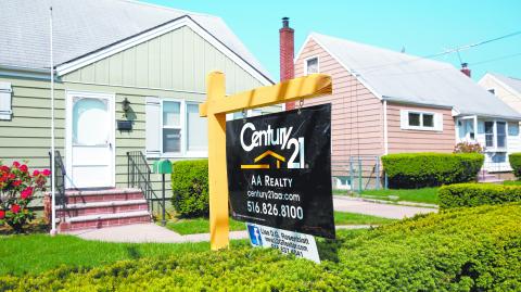 A 'for sale' is seen outside a single family house in Uniondale, New York, U.S., May 23, 2016.  REUTERS/Shannon Stapleton