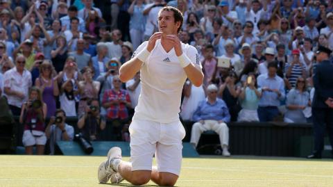 FILE PHOTO: Andy Murray of Britain reacts after defeating Novak Djokovic of Serbia in their men