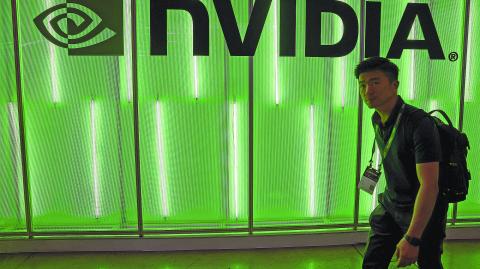 FILE PHOTO: A person walks pass a Nvidia logo at Computex in Taipei, Taiwan June 5, 2024. REUTERS/Ann Wang/File Photo-NARCH/NARCH30